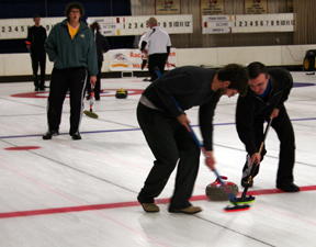 Curlers preparing on the ice