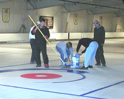 Friends helping paint the ice